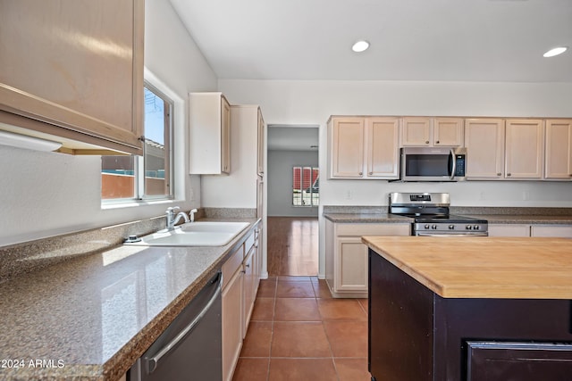 16914 E Britt Ct, Fountain Hills, AZ 85268 - kitchen with recessed lighting, a sink, wood counters, tile patterned flooring, and appliances with stainless steel finishes