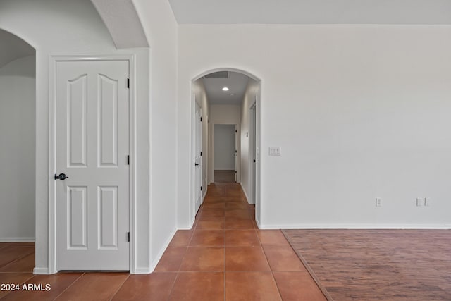 16914 E Britt Ct, Fountain Hills, AZ 85268 - hallway with tile patterned floors, baseboards, and arched walkways