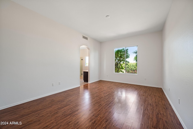 16914 E Britt Ct, Fountain Hills, AZ 85268 - spare room with wood finished floors, baseboards, visible vents, and arched walkways