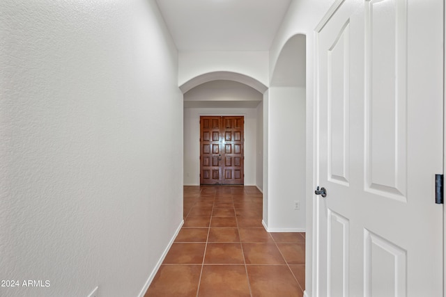 16914 E Britt Ct, Fountain Hills, AZ 85268 - hallway featuring baseboards, arched walkways, and tile patterned flooring