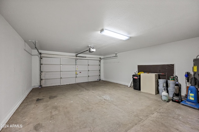 16914 E Britt Ct, Fountain Hills, AZ 85268 - garage featuring a garage door opener and baseboards