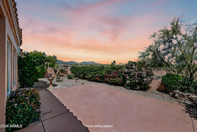16914 E Britt Ct, Fountain Hills, AZ 85268 - patio terrace at dusk with a mountain view and fence