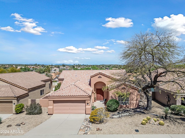 16914 E Britt Ct, Fountain Hills, AZ 85268 - mediterranean / spanish home featuring stucco siding, driveway, a tile roof, and a garage