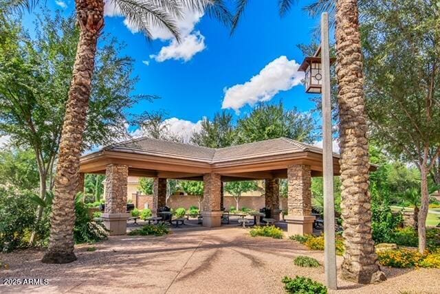 surrounding community with a gazebo and a patio area