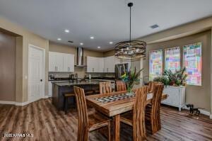 7409 E Weaver Way, Prescott Valley, AZ 86314 - dining space with wood finished floors and recessed lighting