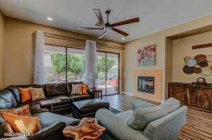7409 E Weaver Way, Prescott Valley, AZ 86314 - living room with a ceiling fan, a fireplace, wood finished floors, and recessed lighting