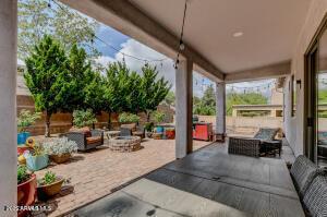 7409 E Weaver Way, Prescott Valley, AZ 86314 - view of patio featuring an outdoor living space with a fire pit