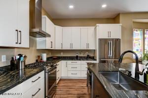 7409 E Weaver Way, Prescott Valley, AZ 86314 - kitchen featuring wall chimney exhaust hood, stainless steel appliances, recessed lighting, and white cabinetry