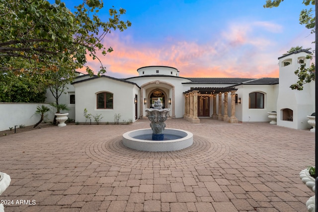 view of front of house with a patio area