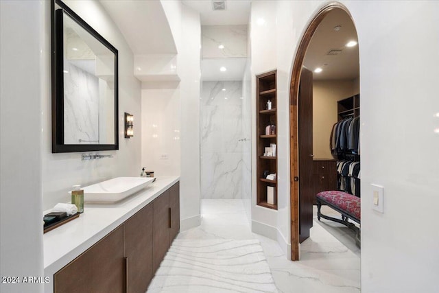 bathroom with vanity and walk in shower