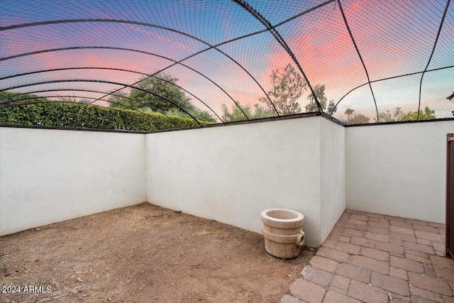 view of patio terrace at dusk