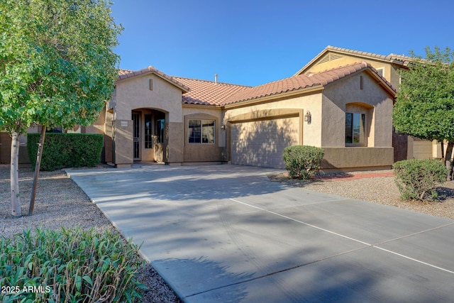 19319 E Thornton Rd, Queen Creek, AZ 85142 - mediterranean / spanish home featuring stucco siding, driveway, a tiled roof, and an attached garage