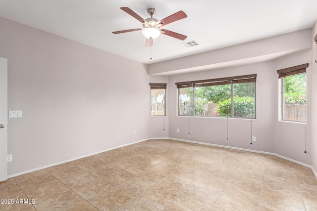 19319 E Thornton Rd, Queen Creek, AZ 85142 - unfurnished room featuring healthy amount of natural light, ceiling fan, and baseboards