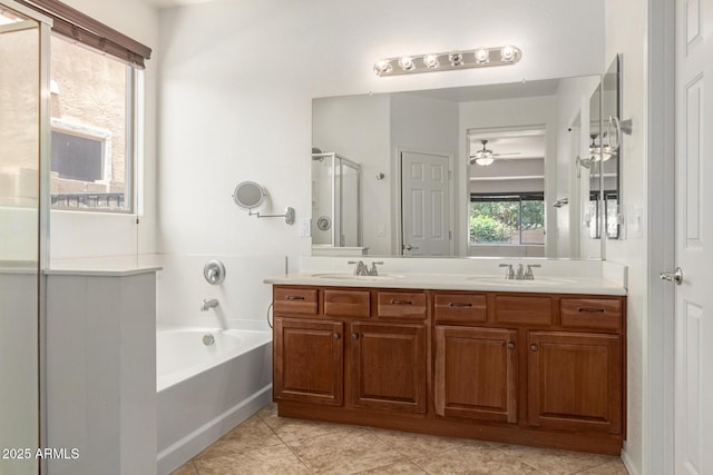 19319 E Thornton Rd, Queen Creek, AZ 85142 - bathroom with double vanity, a bath, tile patterned flooring, a stall shower, and ceiling fan