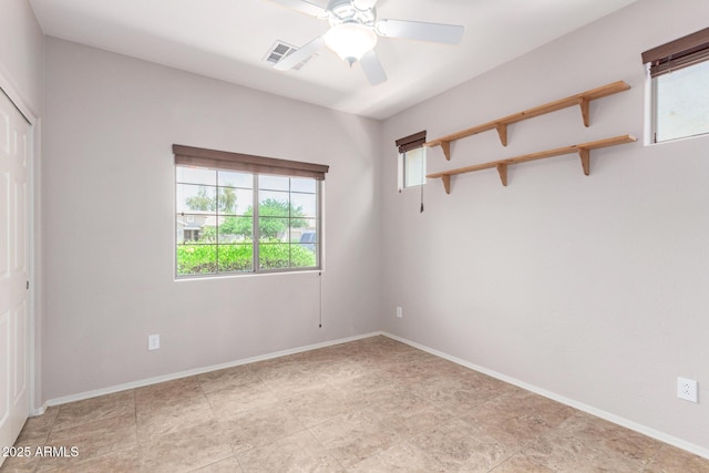 19319 E Thornton Rd, Queen Creek, AZ 85142 - unfurnished bedroom featuring multiple windows, a closet, and baseboards
