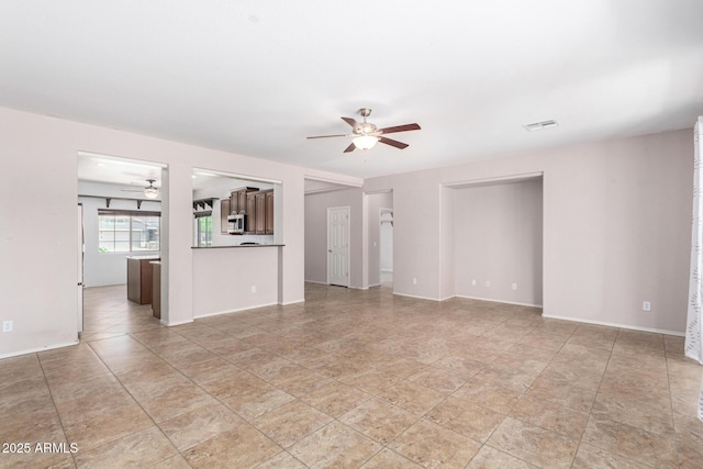 19319 E Thornton Rd, Queen Creek, AZ 85142 - unfurnished living room with a ceiling fan and baseboards