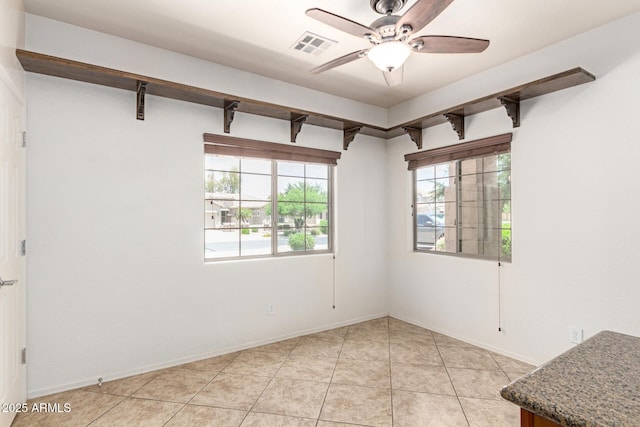 19319 E Thornton Rd, Queen Creek, AZ 85142 - empty room with ceiling fan, light tile patterned floors, and baseboards