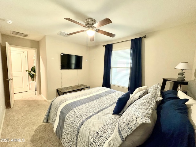 bedroom with ceiling fan and light colored carpet