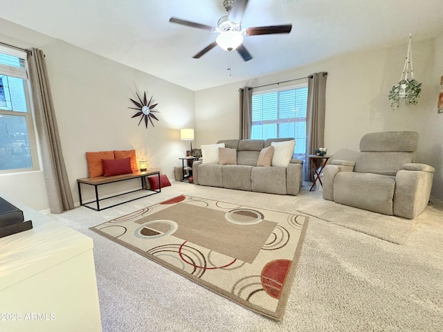 living room with ceiling fan, a healthy amount of sunlight, and carpet