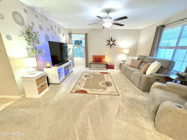 living room featuring ceiling fan and light carpet