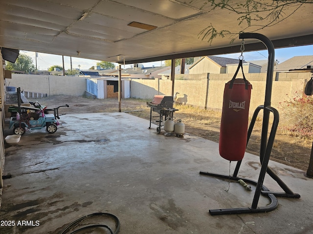 view of patio / terrace featuring a storage shed