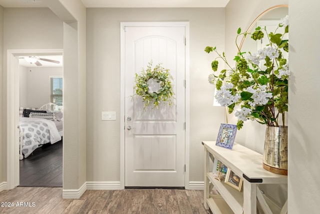 entrance foyer with wood-type flooring and ceiling fan