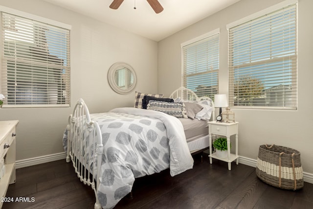 bedroom featuring dark hardwood / wood-style flooring and ceiling fan