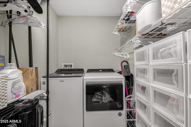 washroom with laundry area and washer and dryer