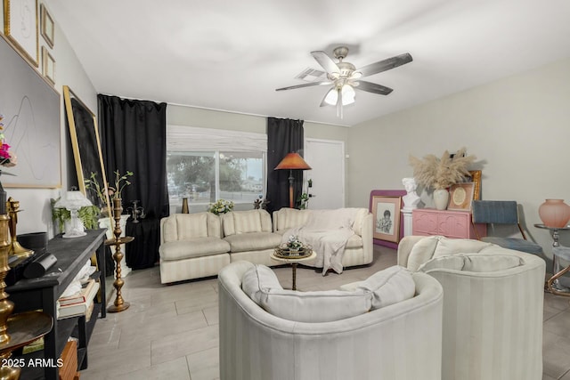 living area with a ceiling fan