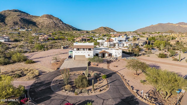 birds eye view of property featuring a mountain view and a residential view