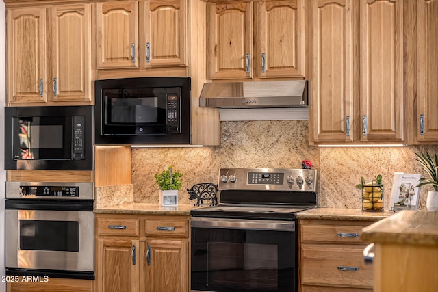 kitchen featuring appliances with stainless steel finishes, light stone counters, backsplash, and under cabinet range hood