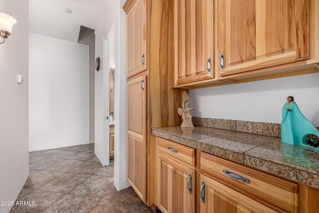 kitchen featuring tile countertops and stone finish floor