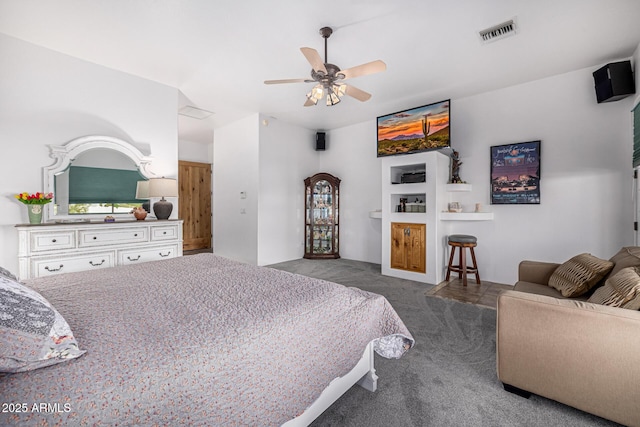 carpeted bedroom featuring visible vents and ceiling fan