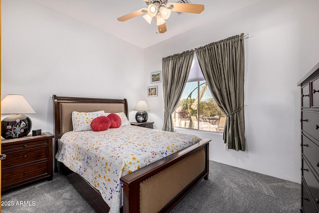 bedroom featuring dark colored carpet and ceiling fan