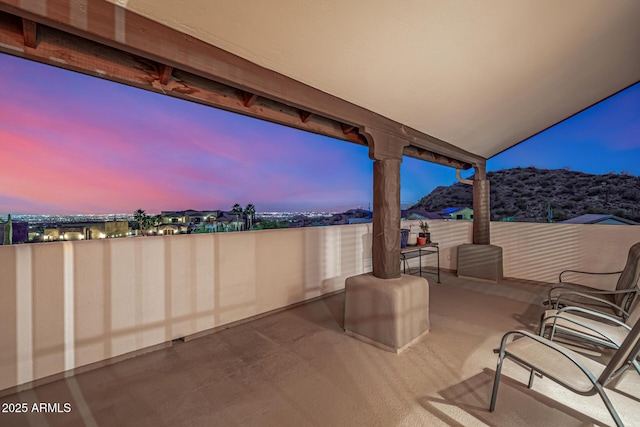 patio terrace at dusk with a mountain view