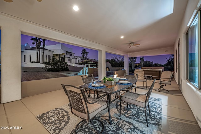 view of patio with outdoor dining space and a ceiling fan