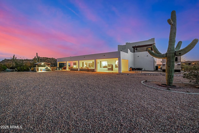 exterior space with a patio and stucco siding