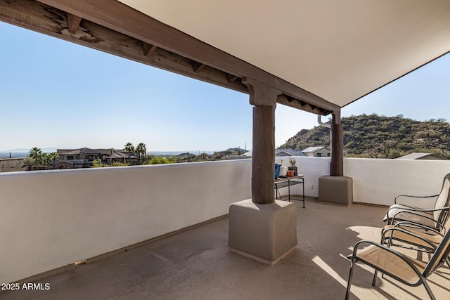 view of patio featuring a balcony
