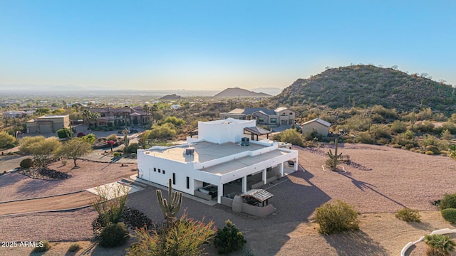 drone / aerial view featuring a mountain view