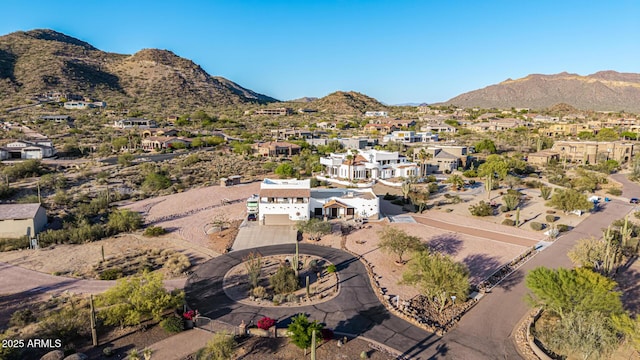 birds eye view of property with a residential view and a mountain view