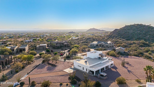 birds eye view of property featuring a mountain view