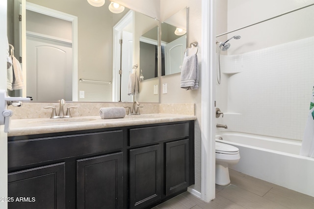 full bathroom with washtub / shower combination, vanity, and toilet