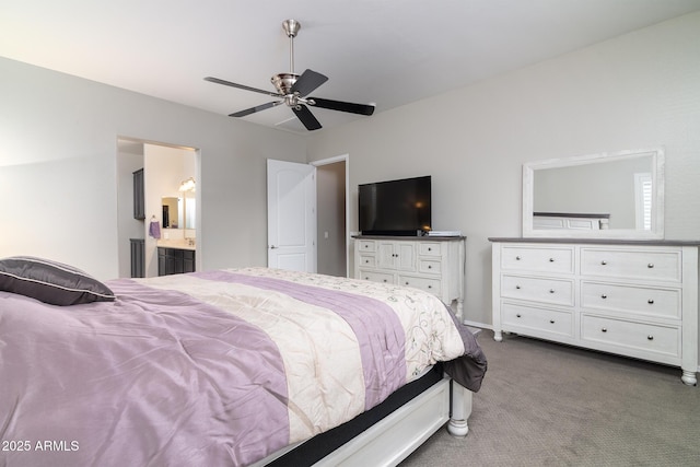 bedroom featuring ensuite bath, ceiling fan, and carpet