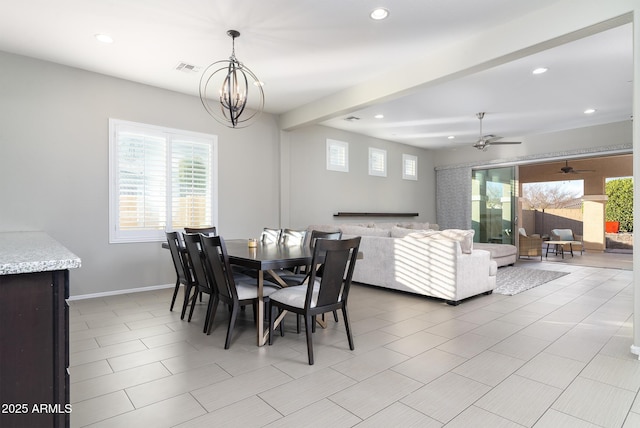 dining room with beam ceiling and ceiling fan with notable chandelier