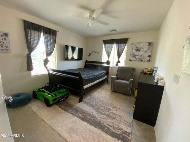 bedroom with visible vents, multiple windows, and a ceiling fan