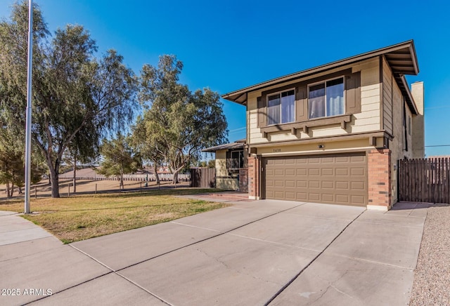 view of front of home with driveway, brick siding, an attached garage, and fence