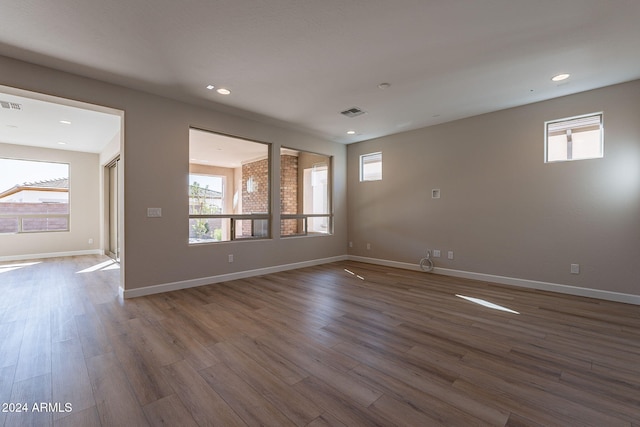 unfurnished room featuring hardwood / wood-style flooring