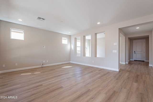 spare room featuring light hardwood / wood-style floors