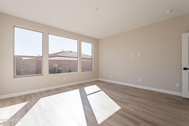 empty room with light wood-type flooring