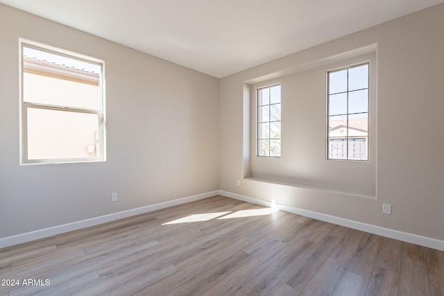 unfurnished room featuring light hardwood / wood-style flooring